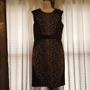 Black waist cinching dress w tan animal print front